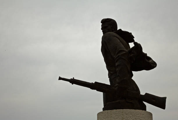 istock Partisan solider whit rifle monument in Durres Albania 847926398