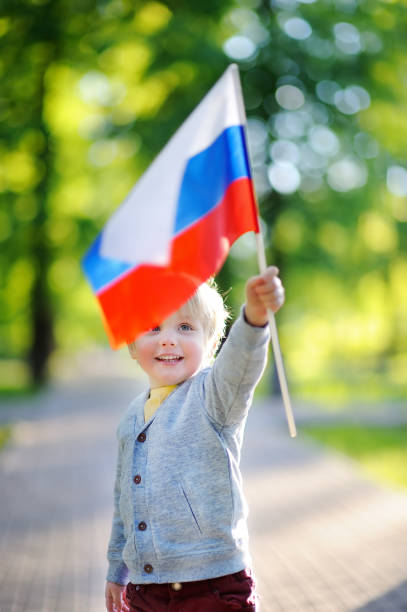 istock Cute little boy holding russian flag 847948328