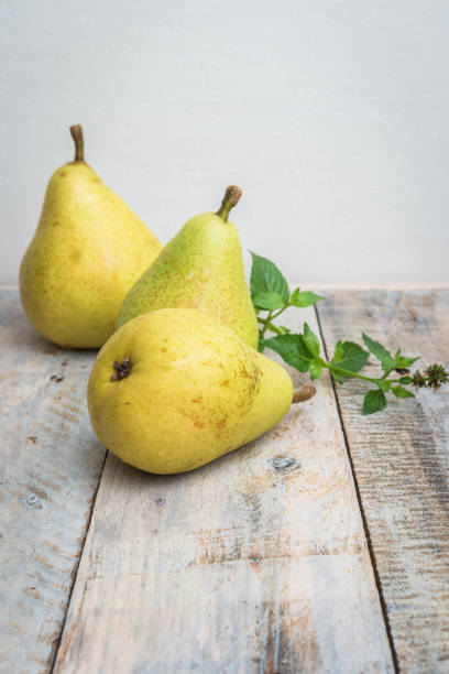 istock Fresh organic pears on old wood. Fruit background. Pear autumn harvest 847959856