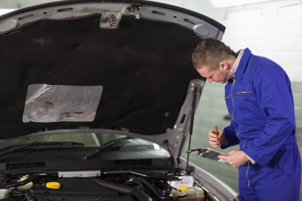 istock Mechanic holding a clipboard 847966240