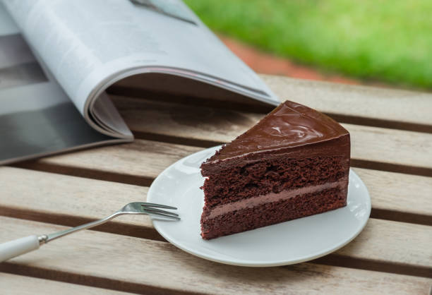 istock Chocolate cake and book on wooden table 847967442