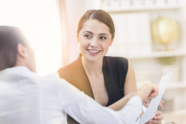 istock Smiling female CEO meets with employee 847973888