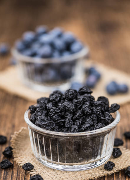 istock Dried Blueberries on wooden background; selective focus 847977488