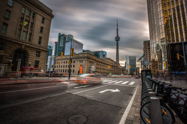 A long exposure showcasing a dramatic sky against downtown Toronto skyline view.