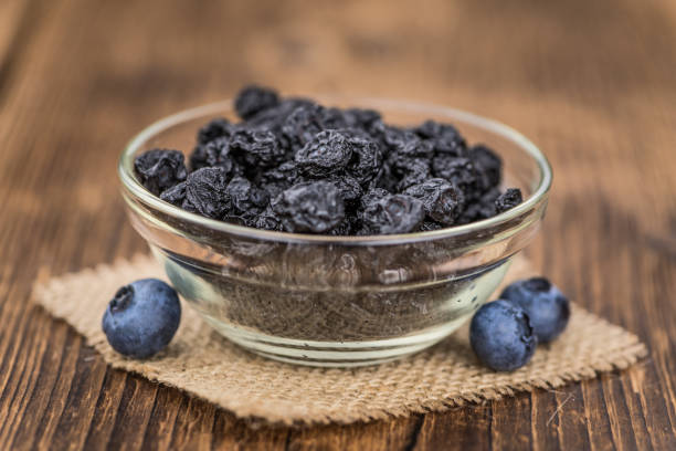 istock Dried Blueberries on wooden background; selective focus 847980730