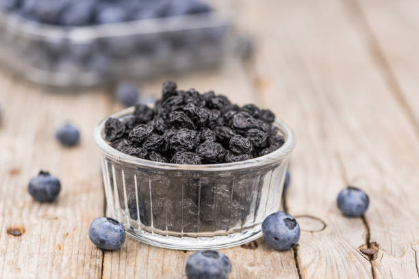 istock Dried Blueberries on wooden background; selective focus 847980788