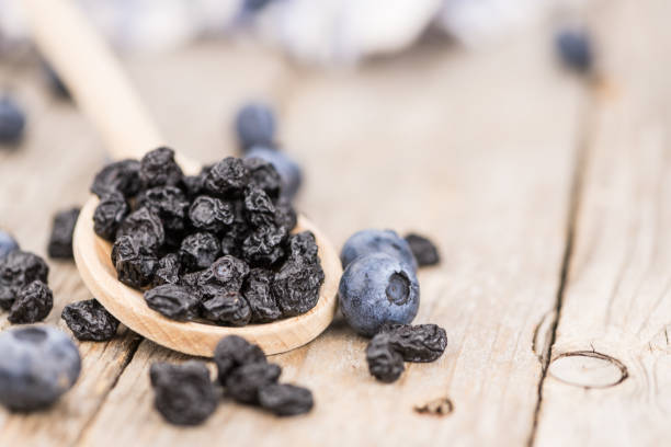 istock Dried Blueberries on wooden background; selective focus 847980962