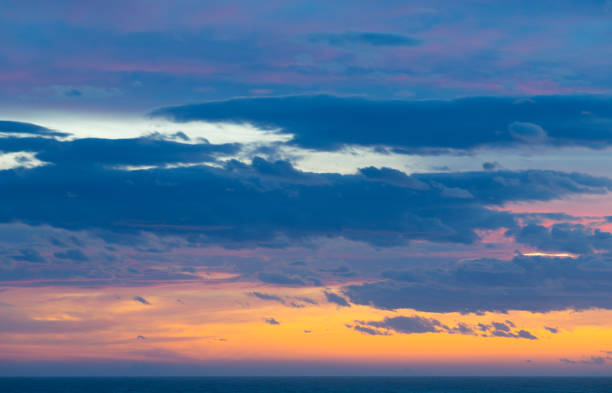 istock Colourful sunset with clouds and sunbeams 847984050