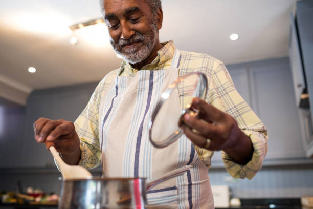 Senior man preparing food at home