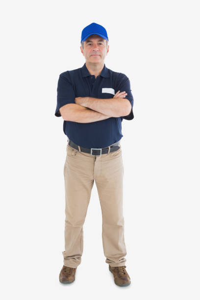 istock Confident delivery man with arms crossed 848016978