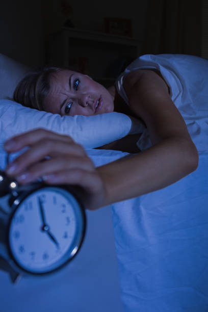 istock Blonde woman stopping her alarm clock 848020674