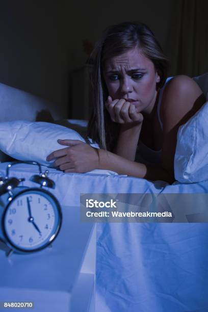 Unquiet Woman In The Bed At Night Stock Photo - Download Image Now - 20-24 Years, 20-29 Years, Adult