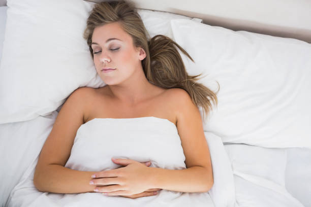 istock Calm woman sleeping in white bedroom 848021028