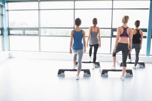 istock Four women stepping on boards 848021234