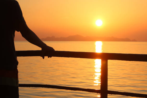 istock The sunlight reflects to the sea with red sky sunset 848032560