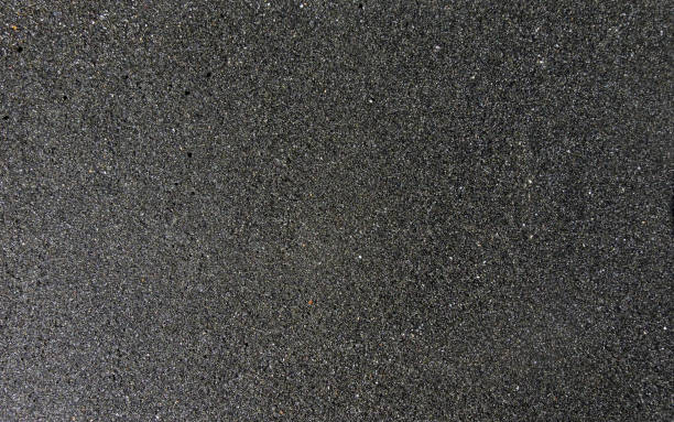 istock the texture of black sand, concept background, natural background 848037092