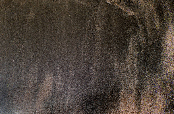 istock the texture of black sand, concept background, natural background 848039376