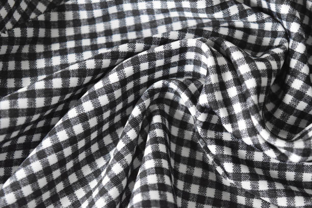 istock Cotton fabric natural and has a soft ripple. Grid pattern black and white and rough surface background. 848042862