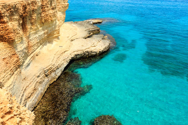 Picturesque seascape with cliffs, at Torre Sant Andrea, Salento sea coast, Puglia, Italy.