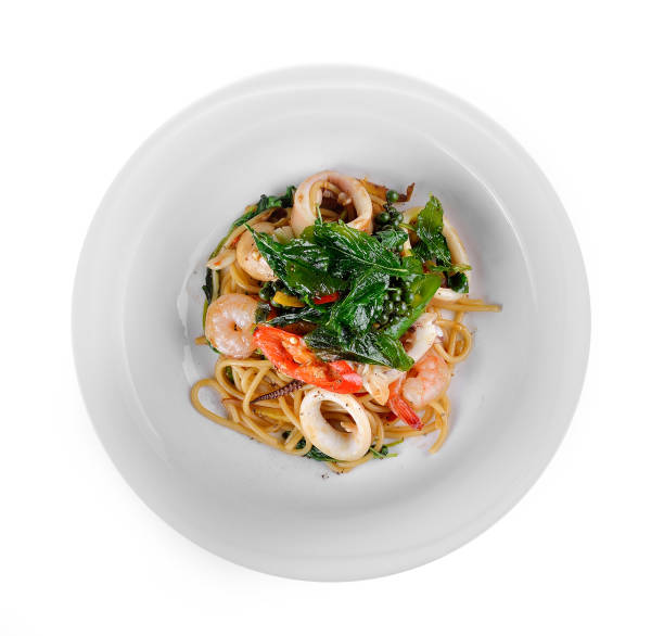 istock Spaghetti drunken seafood in the white plate on white background 848054648