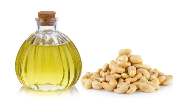 istock Oil bottle and cashew nut on white background 848054694