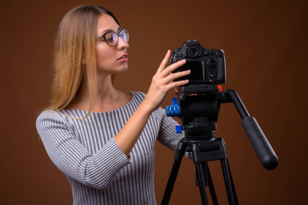 istock Studio shot of young beautiful woman getting ready for vlogging against colored background 848062918
