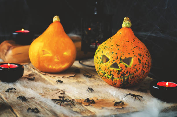 istock Halloween horror background with a spider's web, pumpkins, candles, potions 848065668