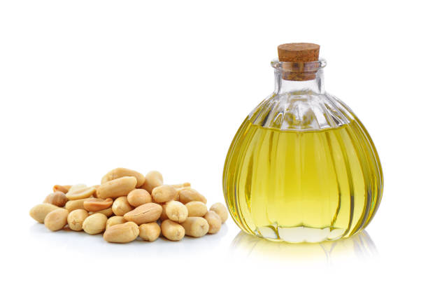 istock Oil bottle and peanuts on white background 848069916