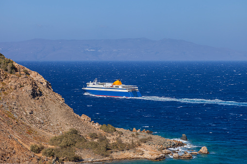 Ship sailing off the coast of Syros in Greece