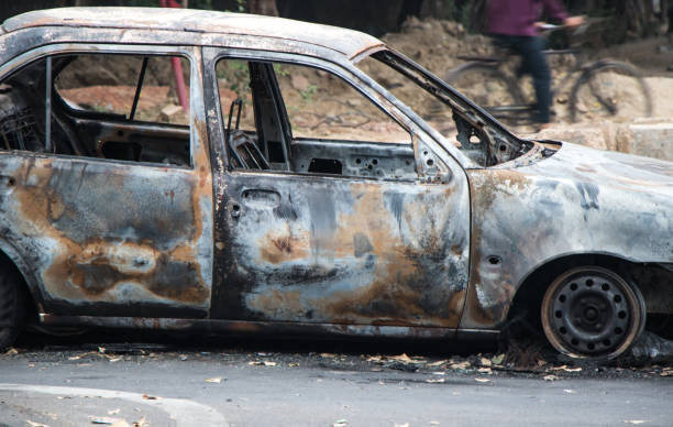 istock Image of a burned car in Road 848079052