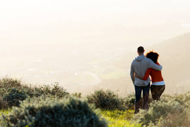 istock Couple standing and watching the sunset. 848081770