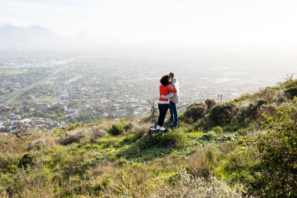 istock Couple standing and watching the sunset. 848081786