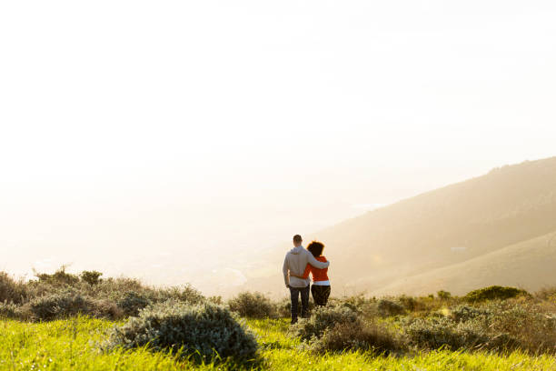 istock Couple standing and watching the sunset. 848081940