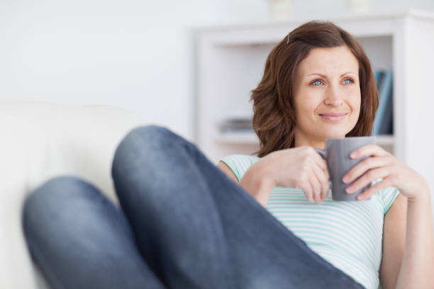 istock Woman looking away while holding a mug 848088926
