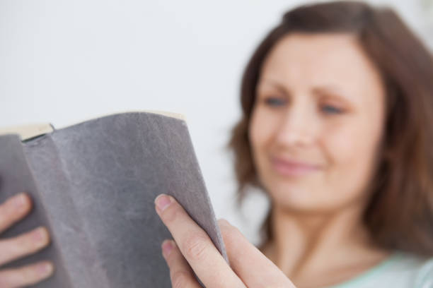 istock Focus on a woman holding a book 848089954