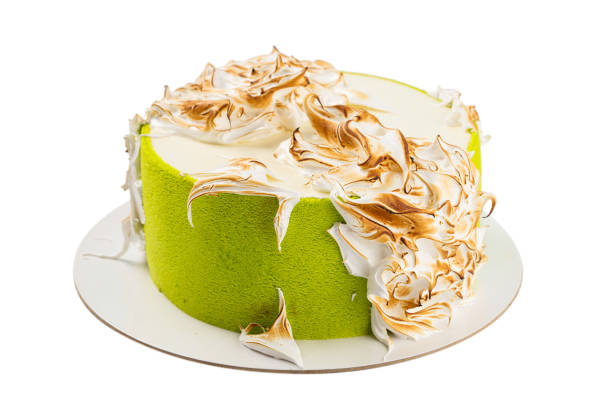 istock Green birthday cake with meringue isolated on white 848090448