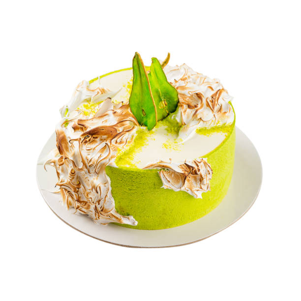 istock Birthday cake with burned meringue and colored pear slices. Isolated on white 848090504