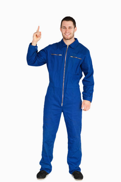 istock Smiling young mechanic in boiler suit pointing up 848107028