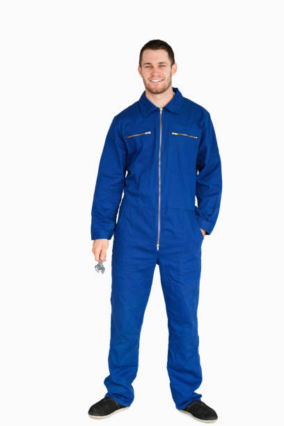 istock Smiling young mechanic in boiler suit holding a wrench 848107112