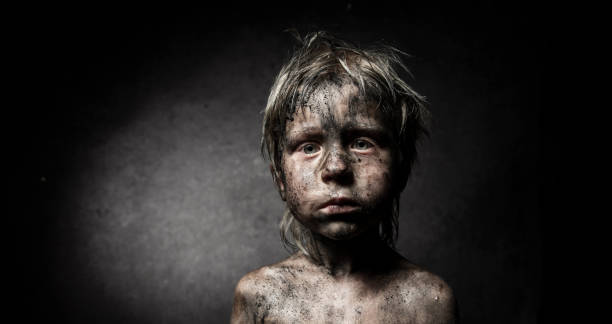 Shock Dramatic portrait of a little  boy frowning headshot close up studio shot stock pictures, royalty-free photos & images