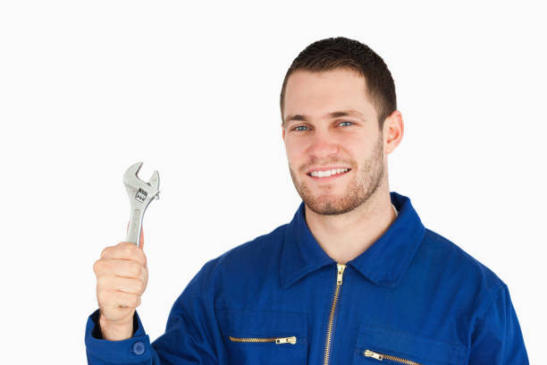 istock Smiling young mechanic holding his wrench 848107286