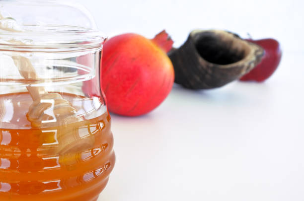 istock Honey jar, Pomegranate Shofar and red apple 848110396