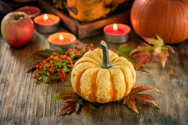istock Autumn table setting with pumpkings and candles, fall home decoration for festive dinner 848111442