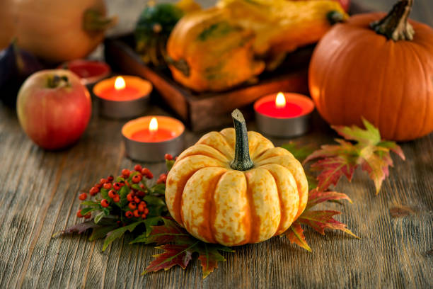 istock Autumn table setting with pumpkings and candles, fall home decoration for festive dinner 848111566