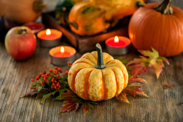 istock Autumn table setting with pumpkings and candles, fall home decoration for festive dinner 848111634