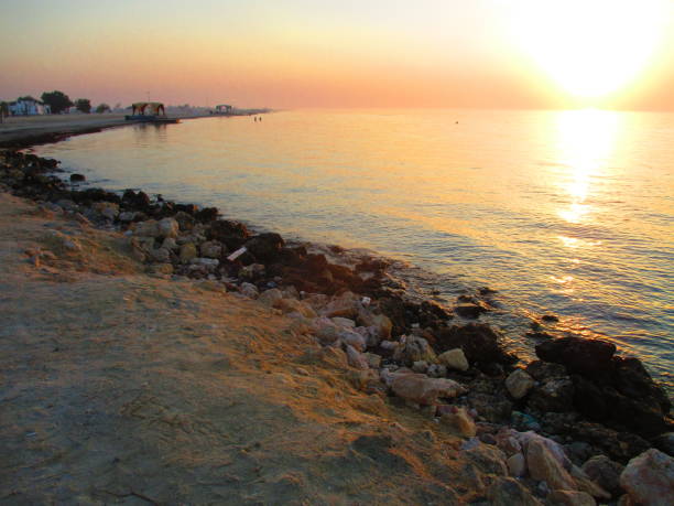 Jazaer Beach, Bahrain at sunset stock photo