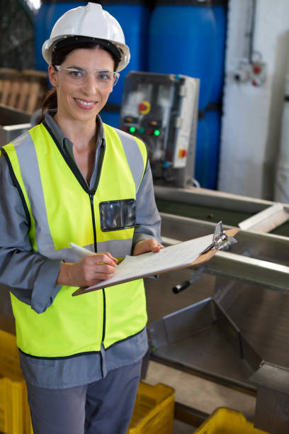 istock Portrait of female technician writing in clipboard 848132948