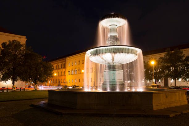 istock Illuminated fountain in downtown Munich, Germany 848143420