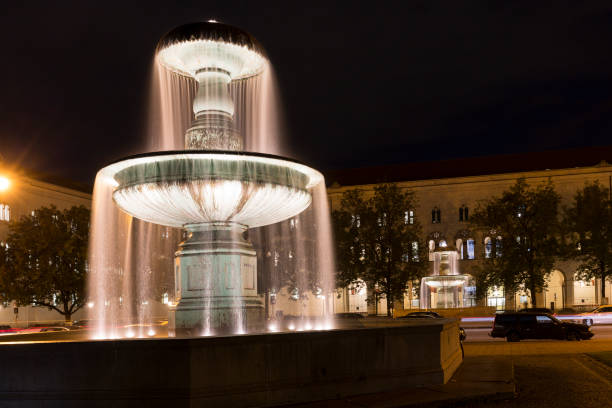 istock Illuminated fountain in downtown Munich, Germany 848143474