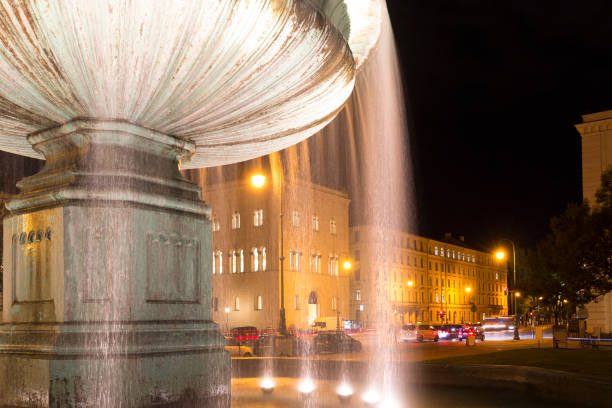 istock Illuminated fountain in downtown Munich, Germany 848143580
